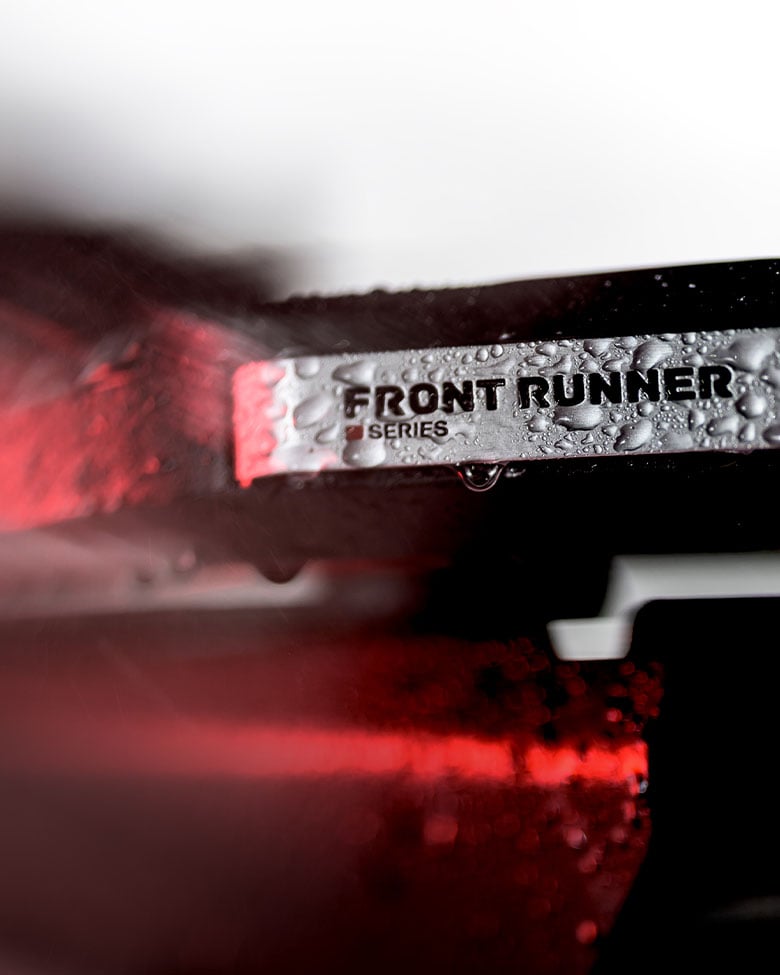 Close-up of the Dometic Front Runner Series Slimline 3 roof rack with water droplets, highlighting durable construction for outdoor adventures