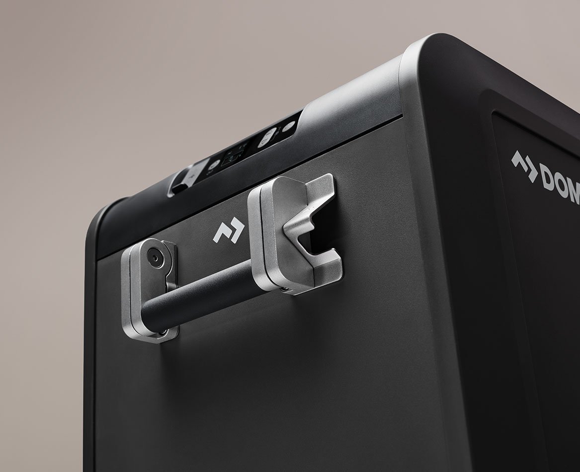 Close-up of a Dometic CFX5 compressor cooler handle, highlighting the durable carry handle and rugged design