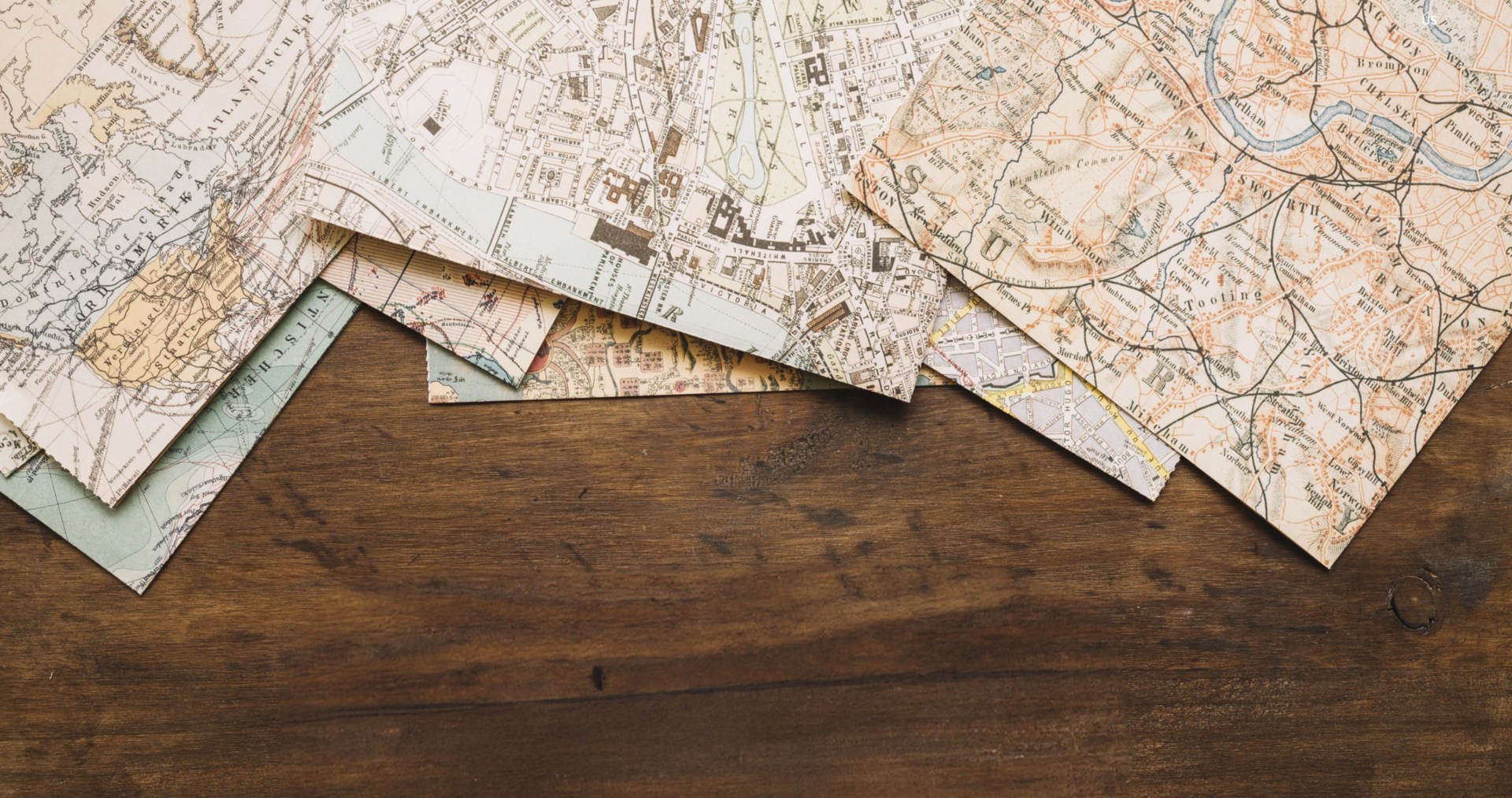 Old maps placed on a wooden table