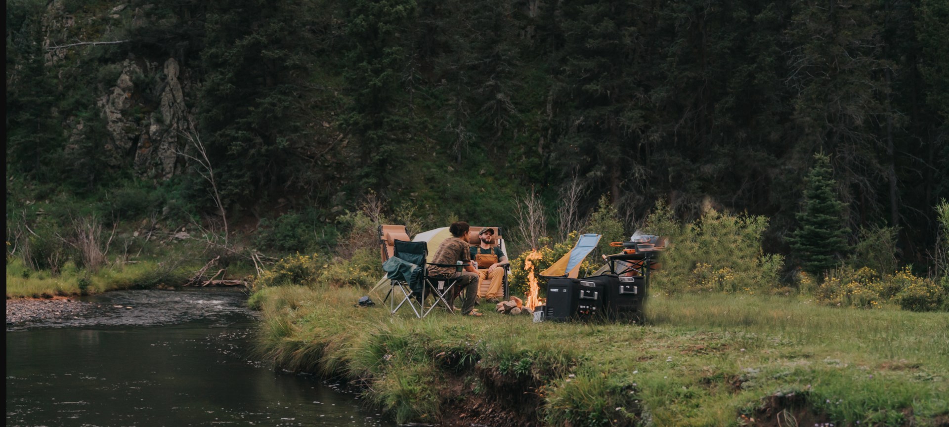 People camping by the river