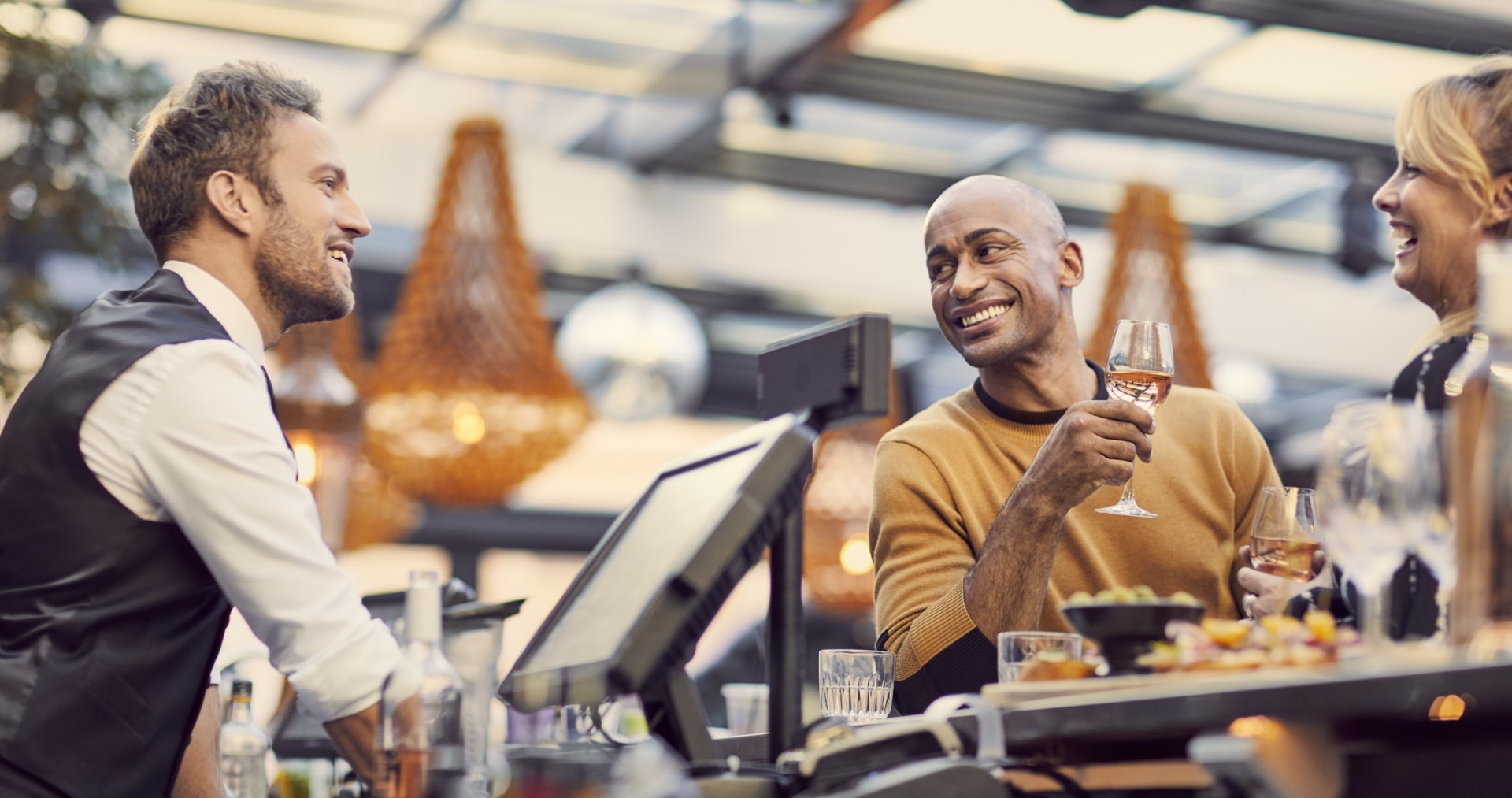 Guests talking with bartender